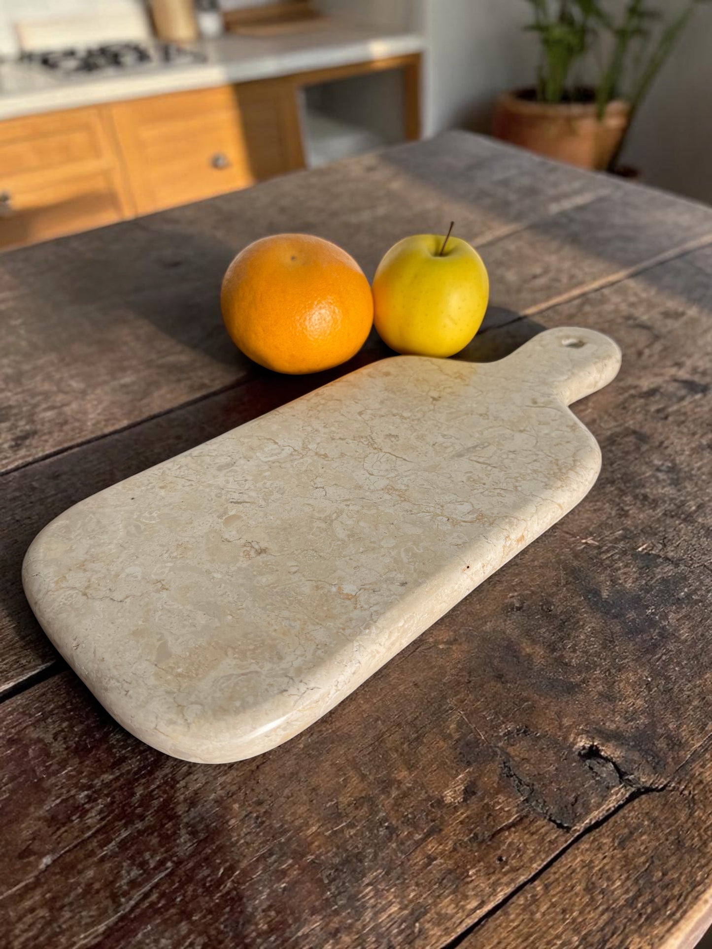 Cream marble cutiing board, hand-carved. Luxury feel and heavy.