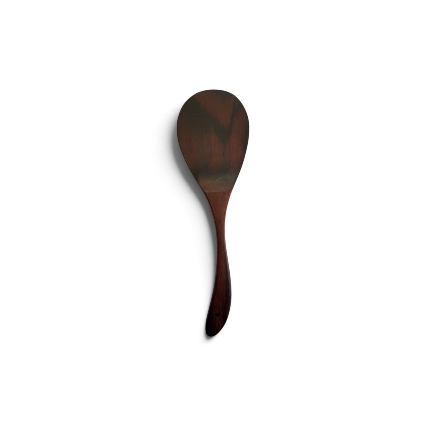 Hand-carved teak wood serving paddle with a broad scoop and hanging hole on a clean white background.