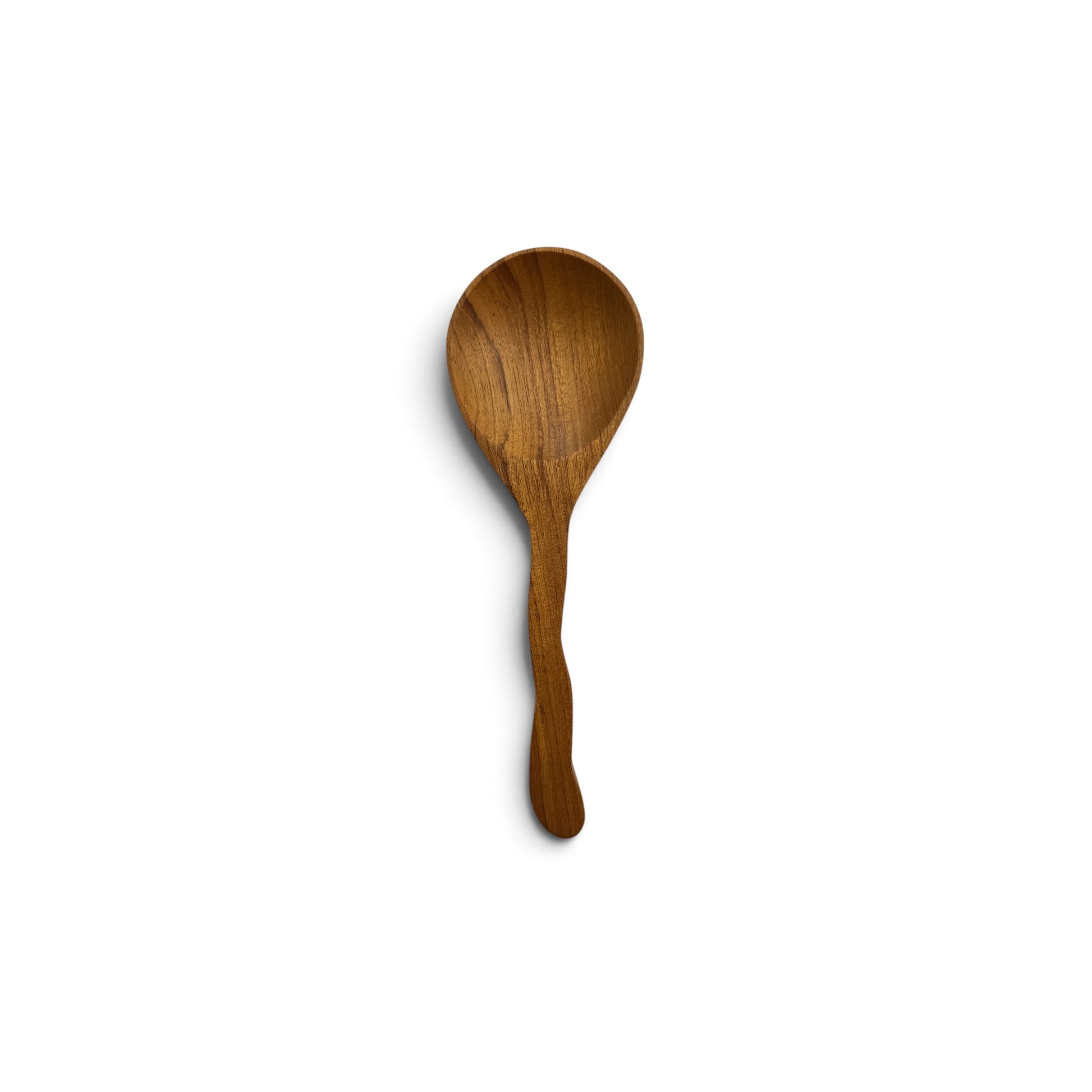 Hand-carved teak wood serving spoon with a wavy handle on a white background.
