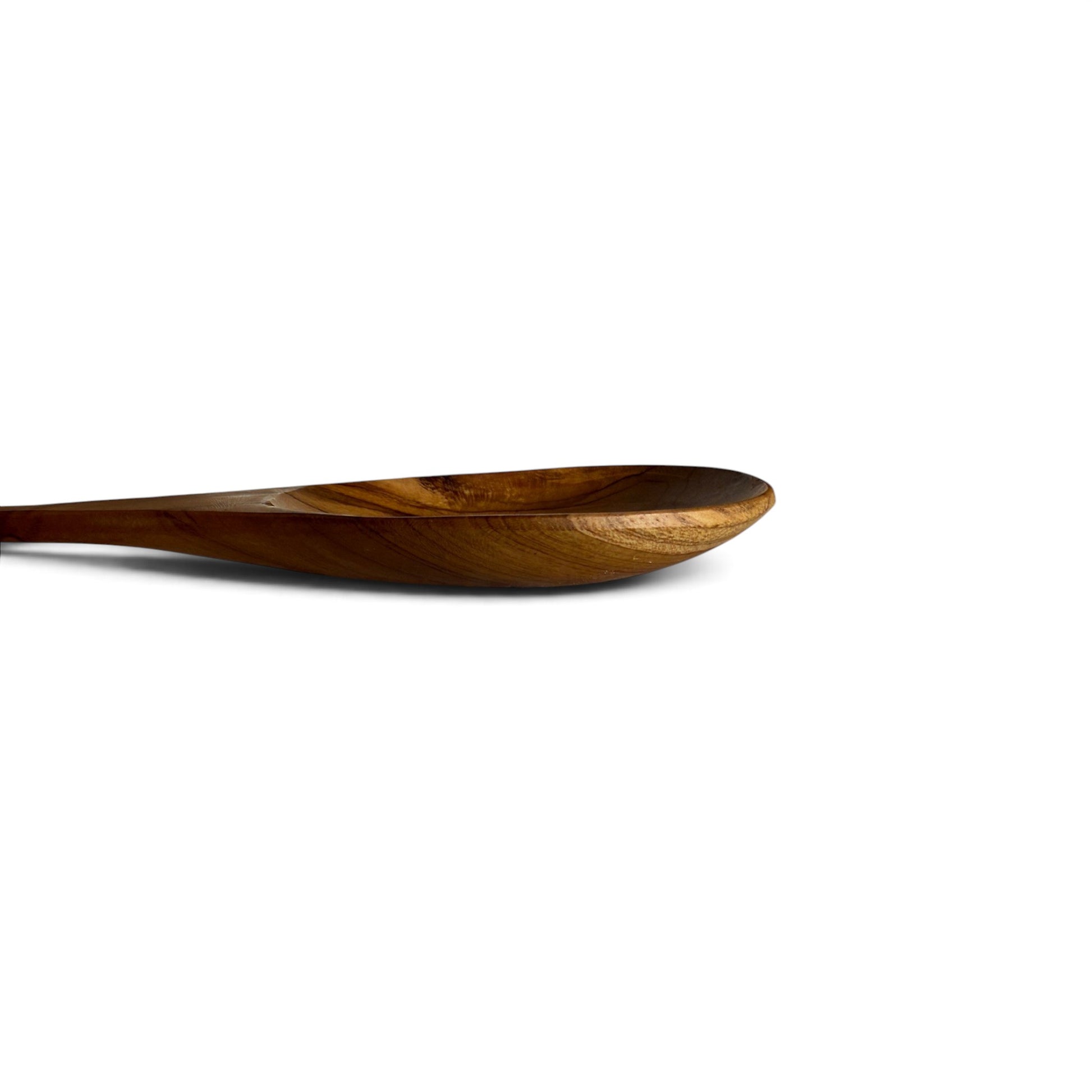 Side elevation view showing the gentle curved stem profile of the long teak serving spoon.