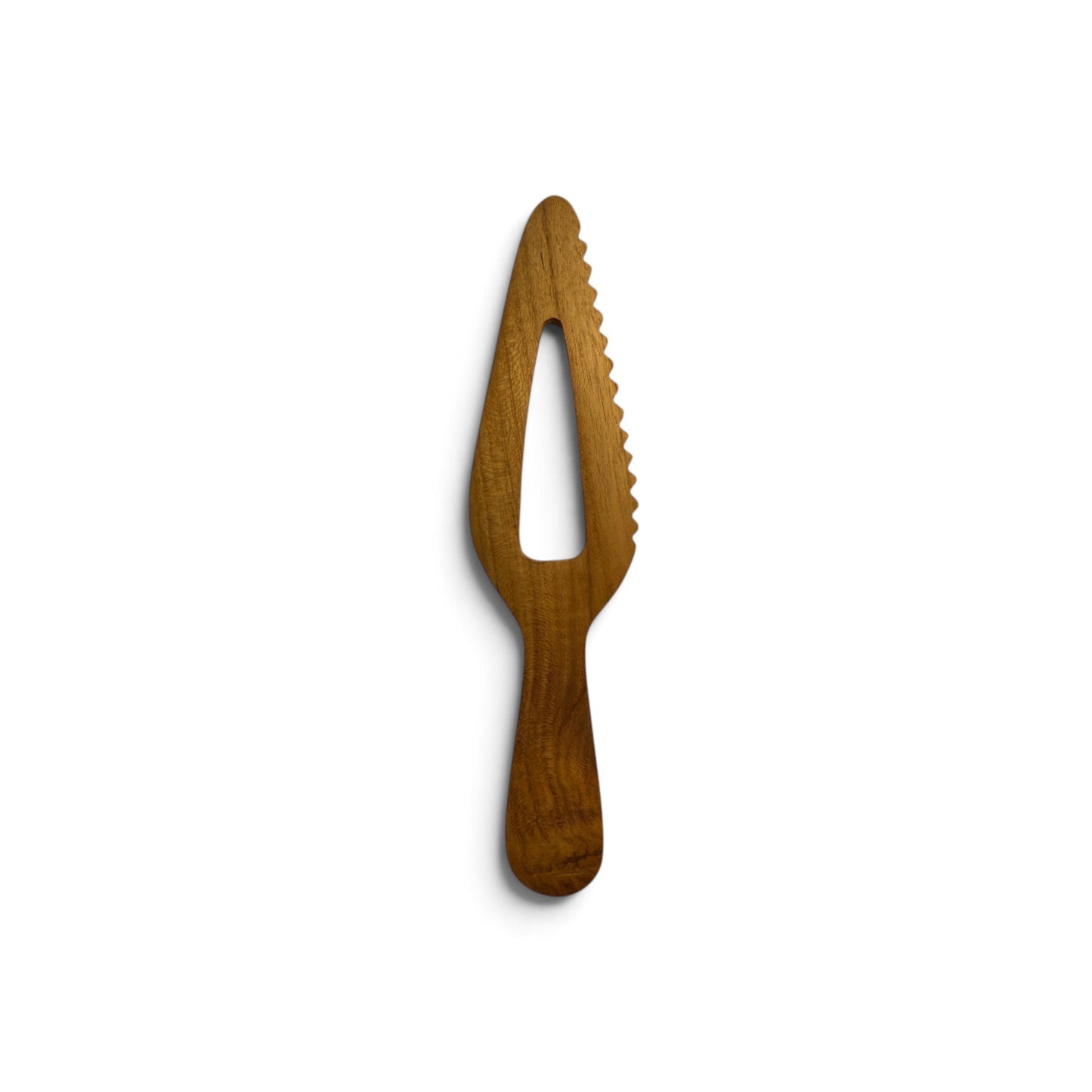 Top-down view of hand-carved serrated teak wood server displaying natural timber grain.