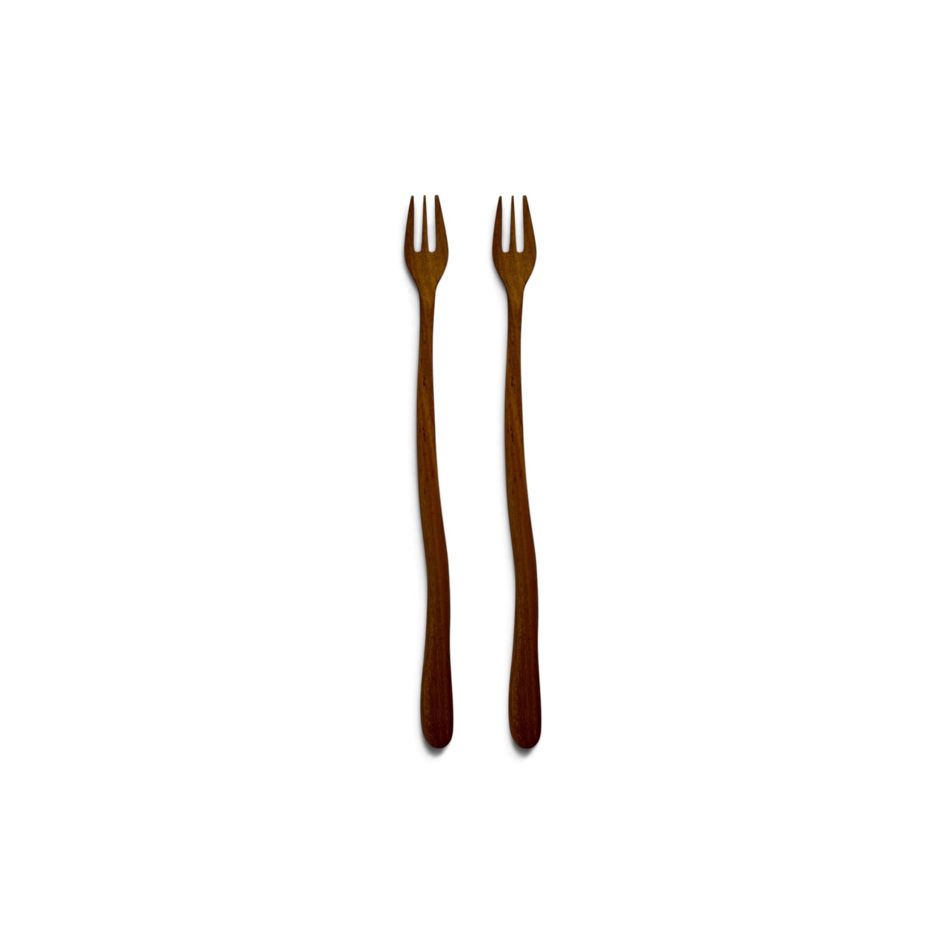Pair of hand-carved teak wood appetizer forks with wavy stems side-by-side on a white background.