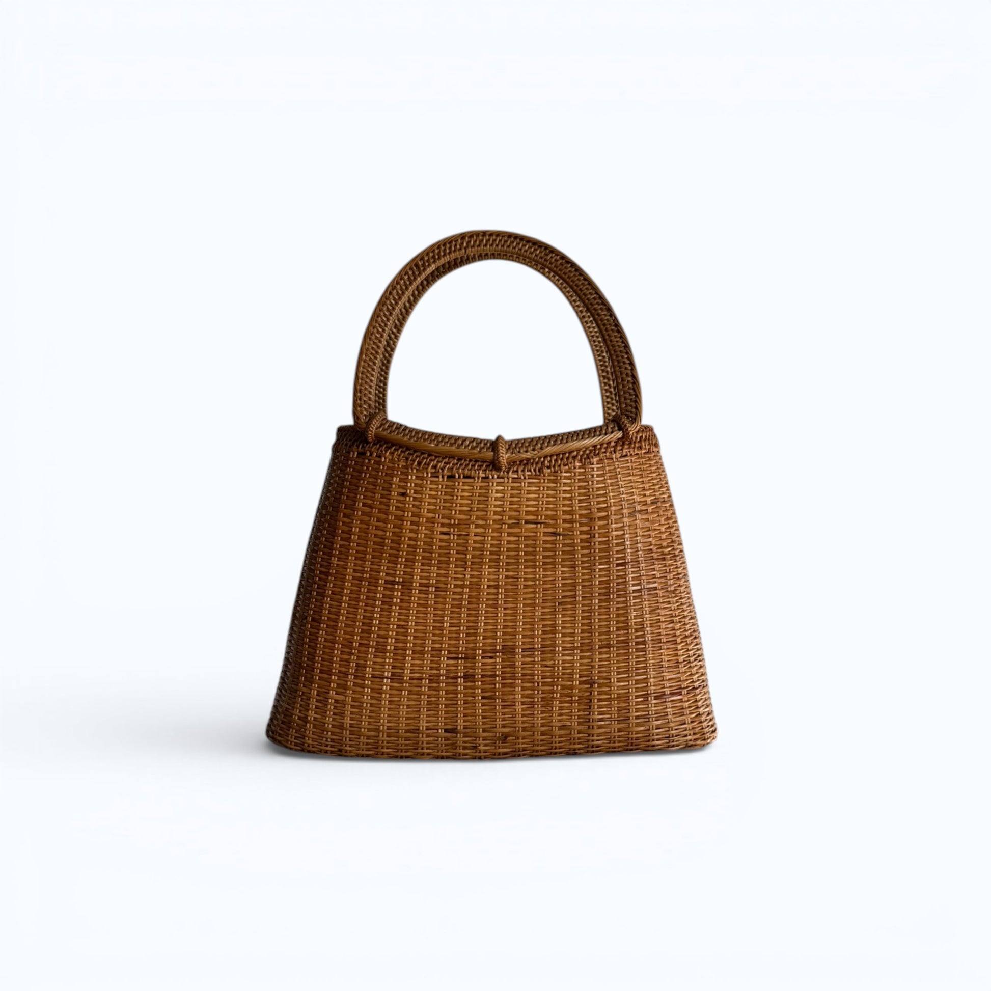 Hand-woven natural raffia tote bag with structured circular handles. Malta.