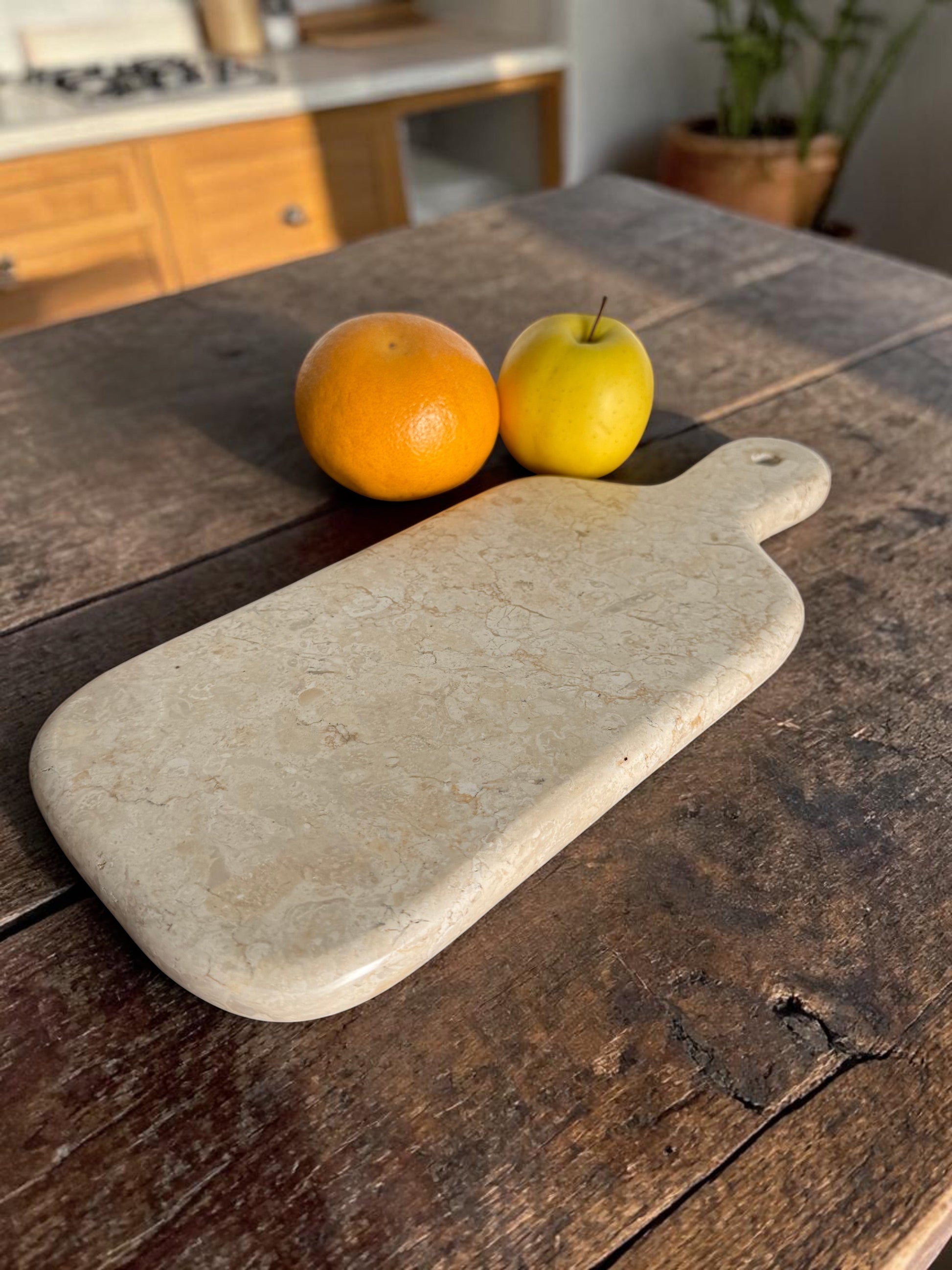 Cream marble cutiing board, hand-carved. Luxury feel and heavy. 
