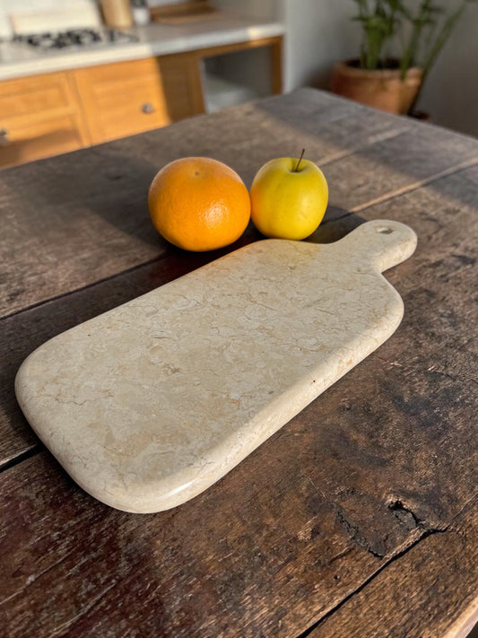 Cream marble cutiing board, hand-carved. Luxury feel and heavy. 