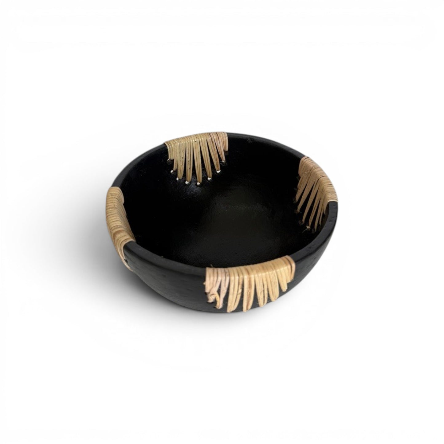 Compact circular matte black terracotta decorative bowl accented with four distinct, separated sections of hand-stitched natural rattan fibers evenly spaced along the rim.