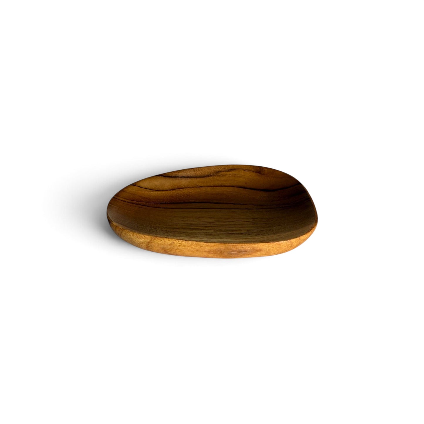 Hand-carved organic pebble teak dish showing its asymmetric 12cm silhouette on a clean white background.