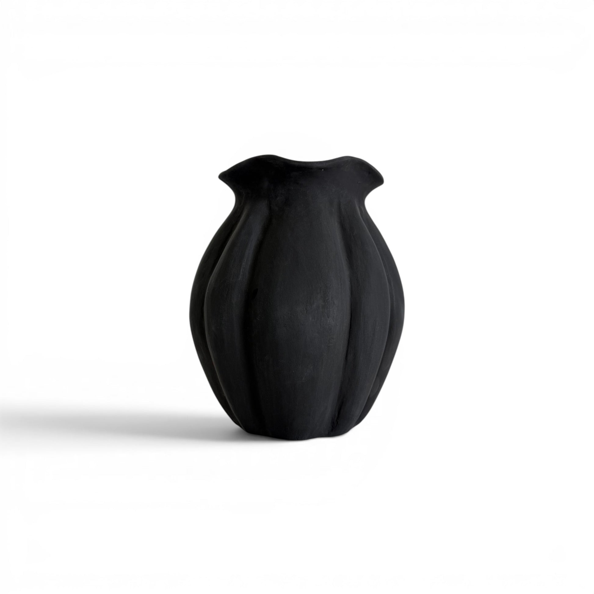 Fluted matte black terracotta vase with a bulbous lobed silhouette and flared wavy rim - Malta