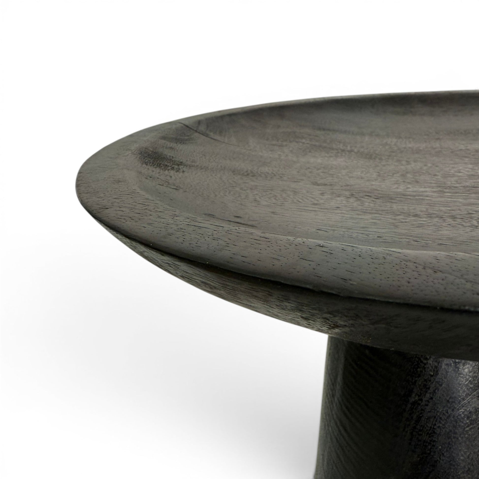 Detailed view of the smooth carved rim and shallow concave top surface of the blackened teak Dulang.