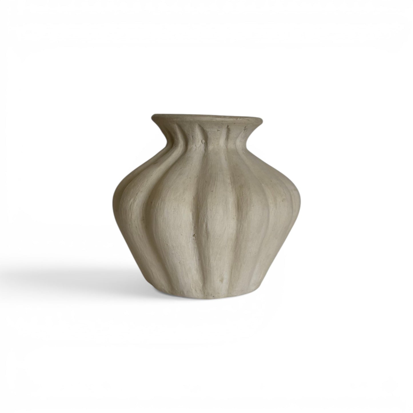 Compact, sandy-beige terracotta vase with deep organic vertical ridges forming a scalloped, bulbous shape with a flared top opening