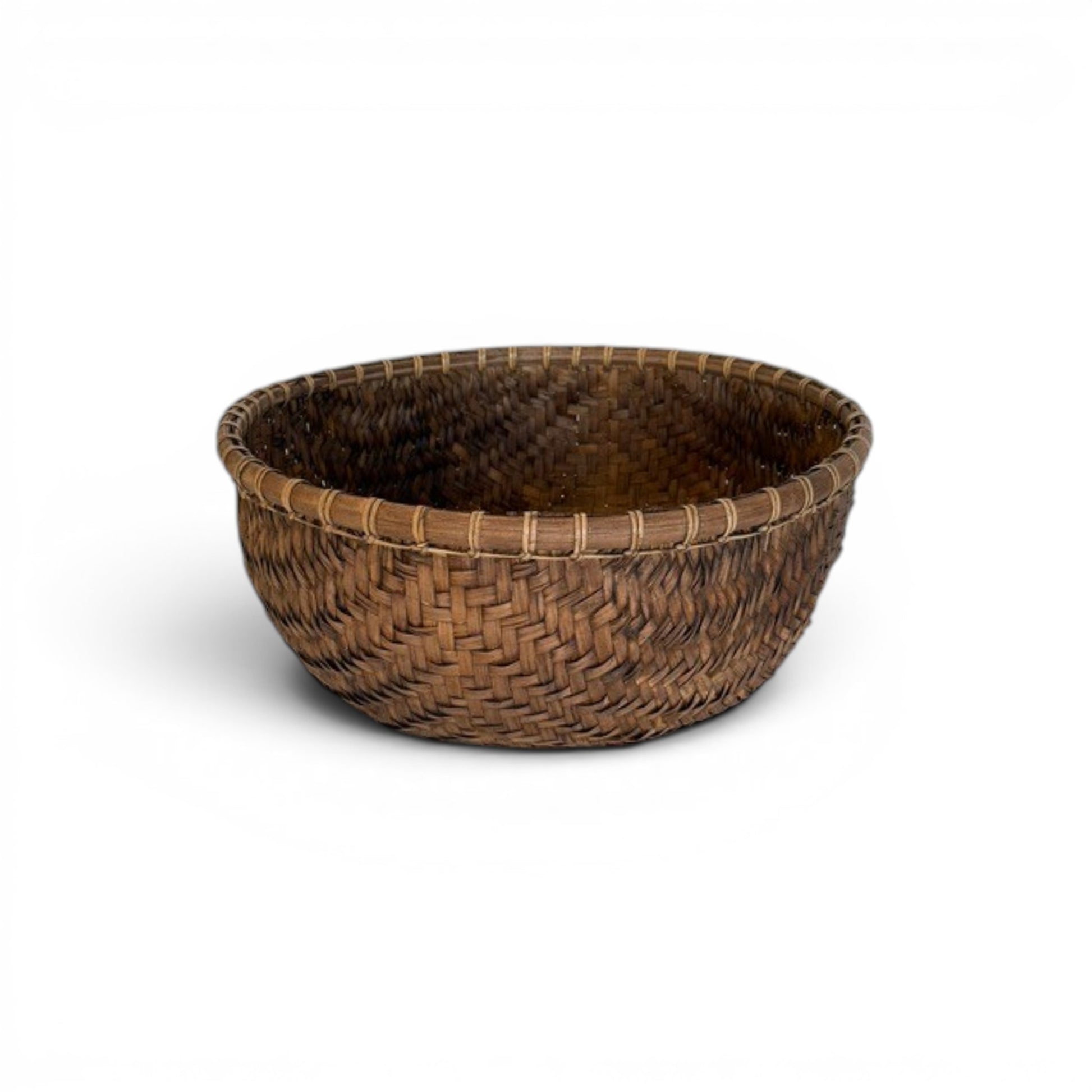 Large circular deep tobacco-brown decorative bowl hand-woven from fine bamboo splits featuring an intricate herringbone pattern and a thick structured rim.