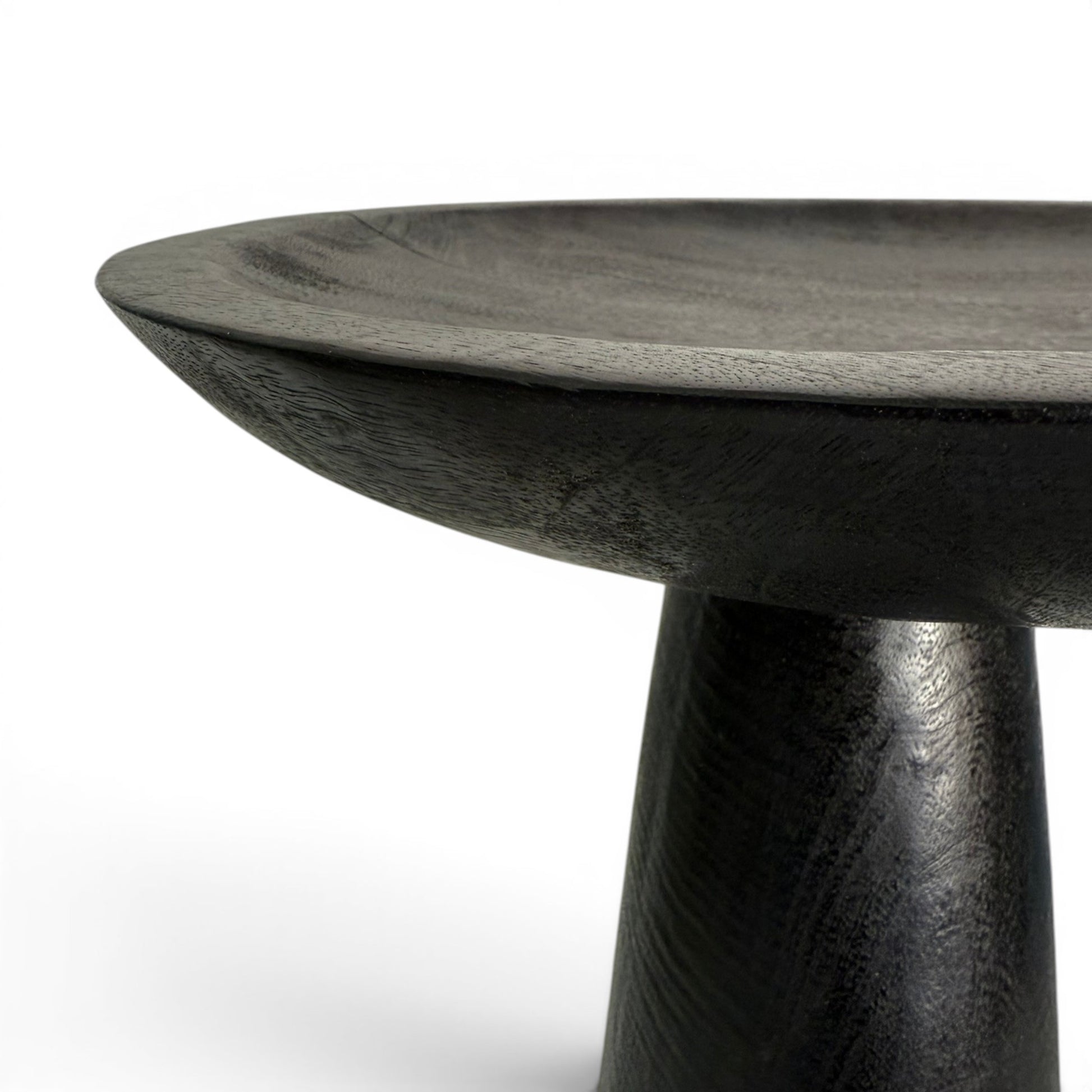 Close-up of texture and teak grain showing through the deep black fired finish on the Dulang stand.