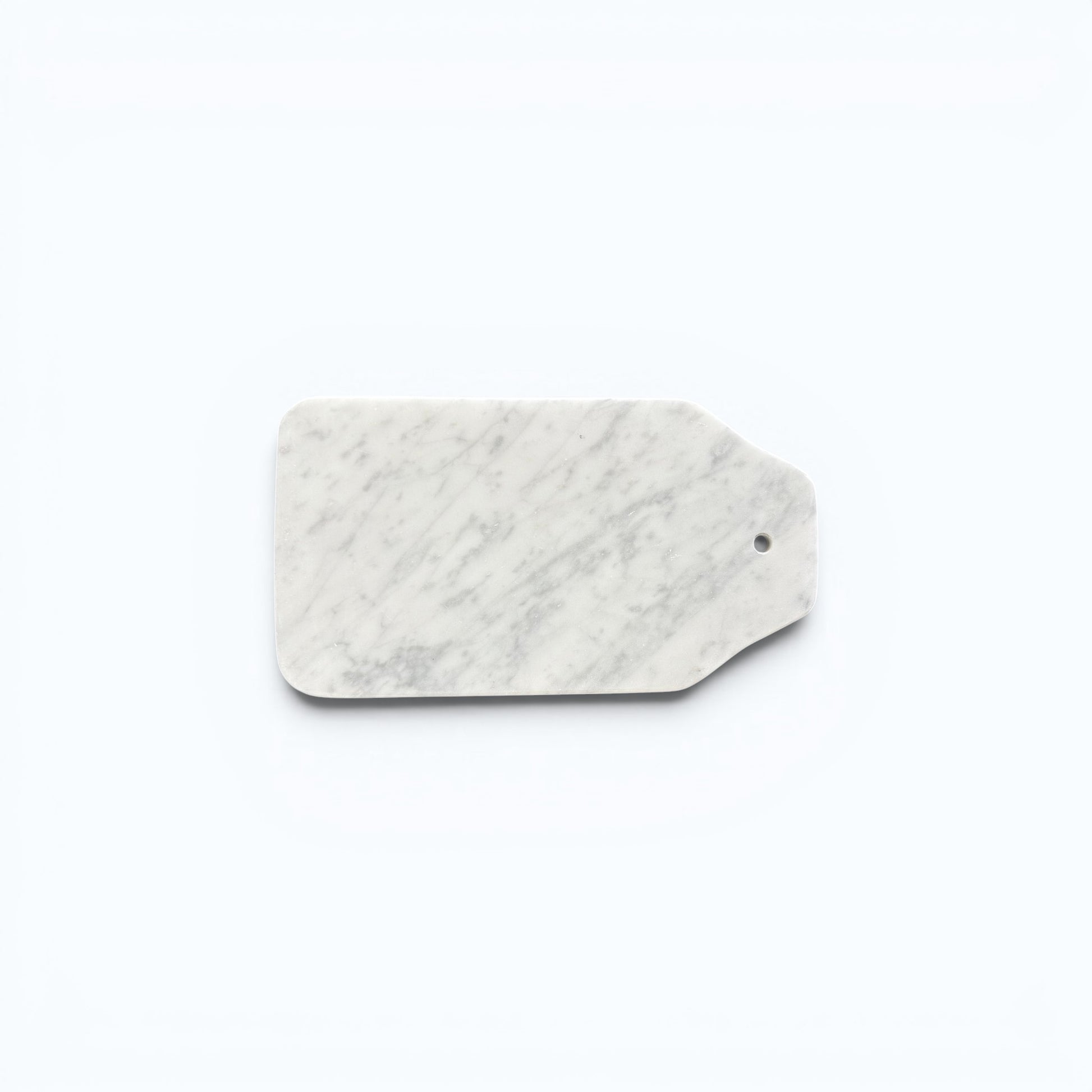 white Carrara marble cheese board with grey veining.