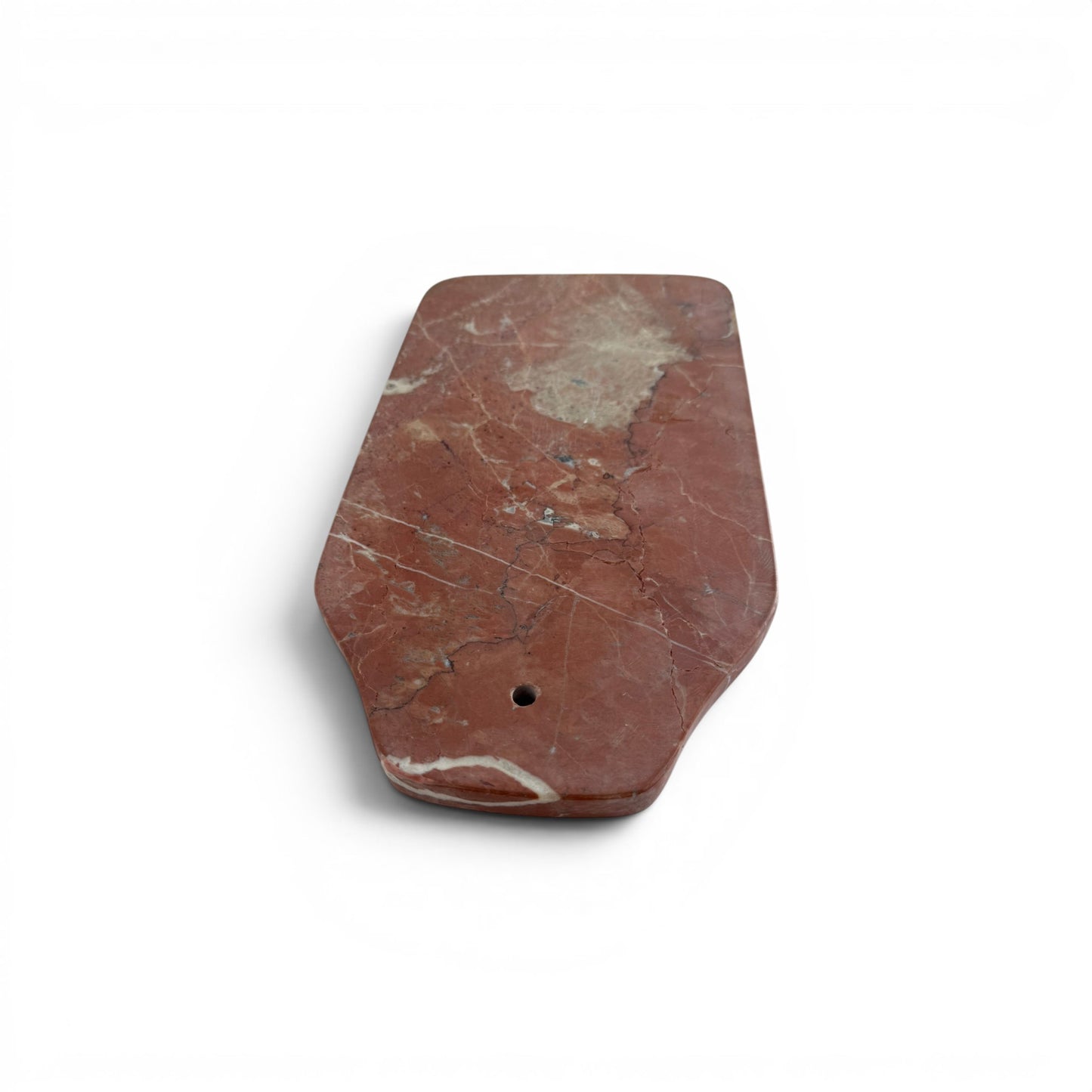 pink Carrara marble cheese board with white veining.